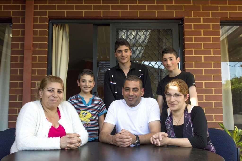 (L-R) Newly arrived Syrian family Wedad, Milad, Micheal, Ghassan and Mark Al Gharbi, and Nazha Lowiss, are a perfect example of the rich cultural diversity that exists within the Catholic Archdiocese of Perth. This will be celebrated at a Multicultural Mass to be held on Friday, 11 November. Photo: Rachel Curry