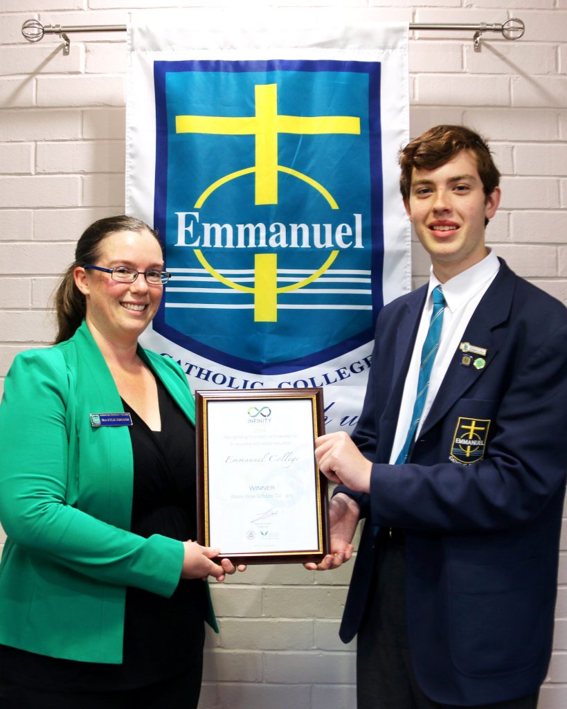 Emmanuel Catholic College teacher Kylie Kingdon, who was recently awarded the 2016 Waste Champion category at this year’s Liberal National Government’s Infinity Awards, displays her award alongside 2017 College Captain, Alex Smith. Photo: Supplied