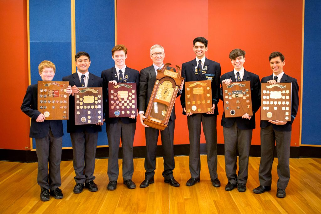 Trinity College Director of Music Dr Robert Braham and Secondary school students with the Zenith award and six shields that they won. Photo: Supplied