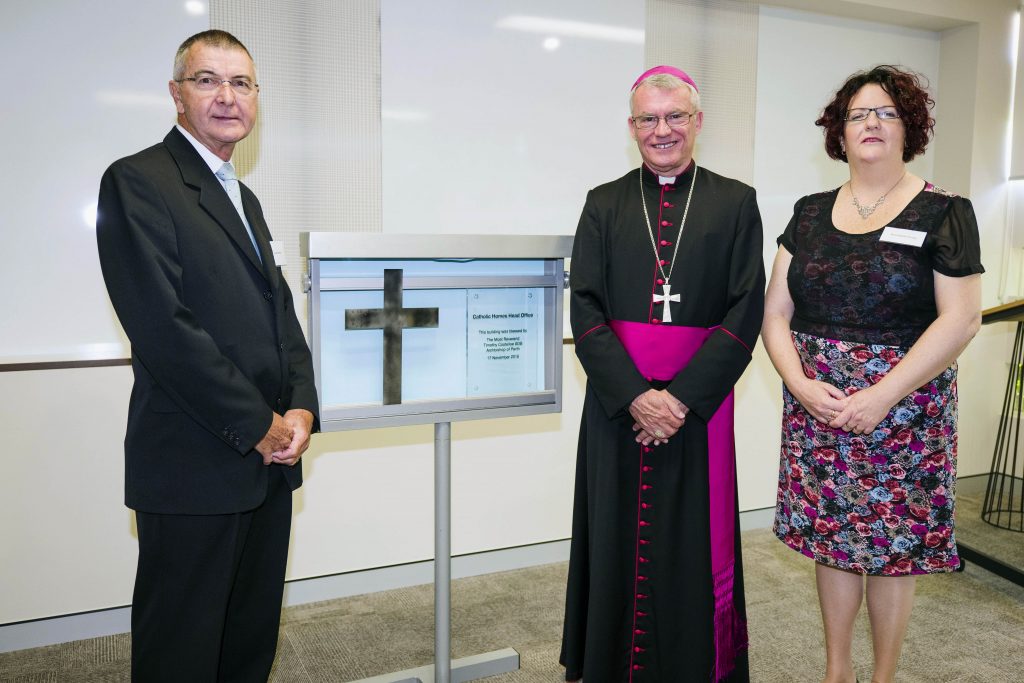 Archbishop Costelloe stands with Catholic Homes Chairman, Peter Messer and Catholic Homes’ Executive Manager of Mission, Bernadette Brady next to the unveiled plaque at the new Burswood Catholic Homes Head Office. Photo: Supplied