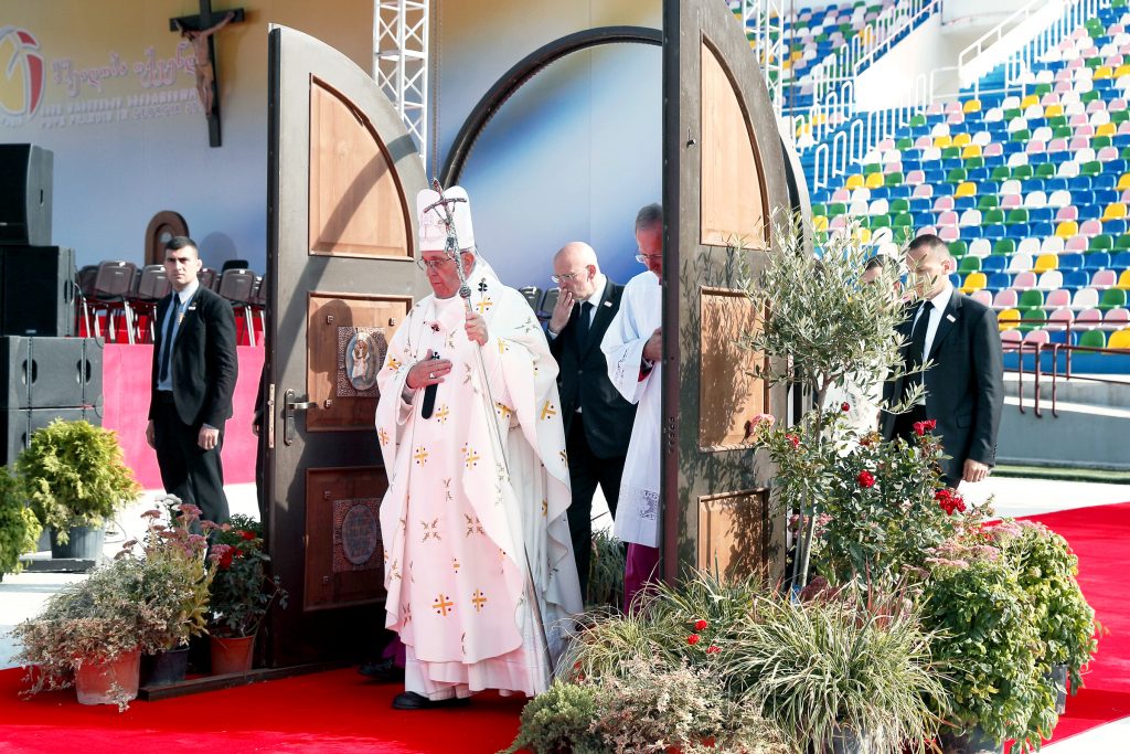 Pope Francis walks through a Holy Door as he arrives to celebrate Mass at Mikheil Meskhi Stadium in Tbilisi, Georgia, on 1 Oct. Photo: CNS/Paul Haring)