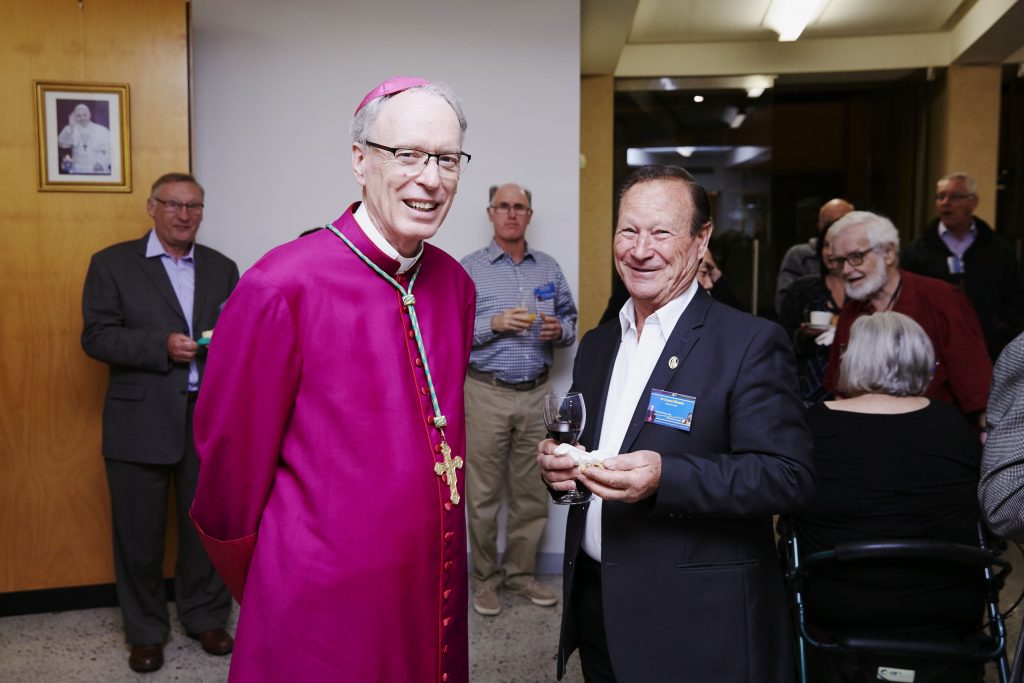 Chairman of LifeLink, Auxiliary Bishop Donald Sproxton, is pictured with appeal representative, Franco Miranda, during refreshments for the special Liturgical Service or the annual Christmas Appeal for LifeLink at St Mary’s Cathedral. Photo: Ron Tan