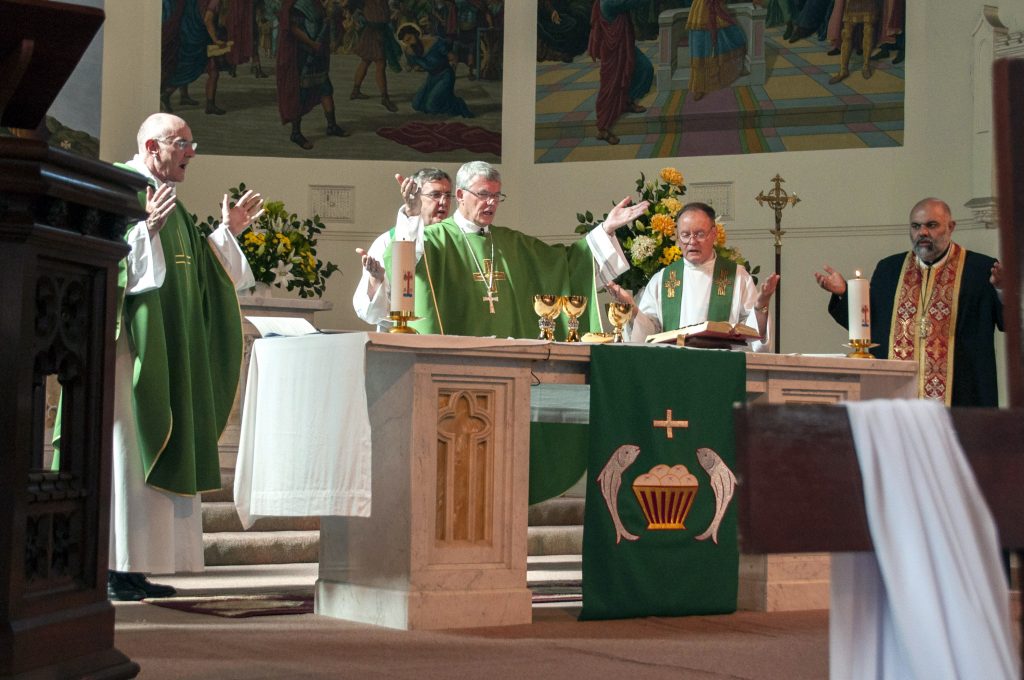 Archbishop Timothy Costelloe celebrates the Eucharist at the Anniversary Mass celebrating the 40 years of the Centre for Faith Enrichment with Fr Vincent Glynn (left), Fr John Hodgson (behind), Fr Charles Waddell and Fr Elias Kilzi (right). Photo: Desire photography