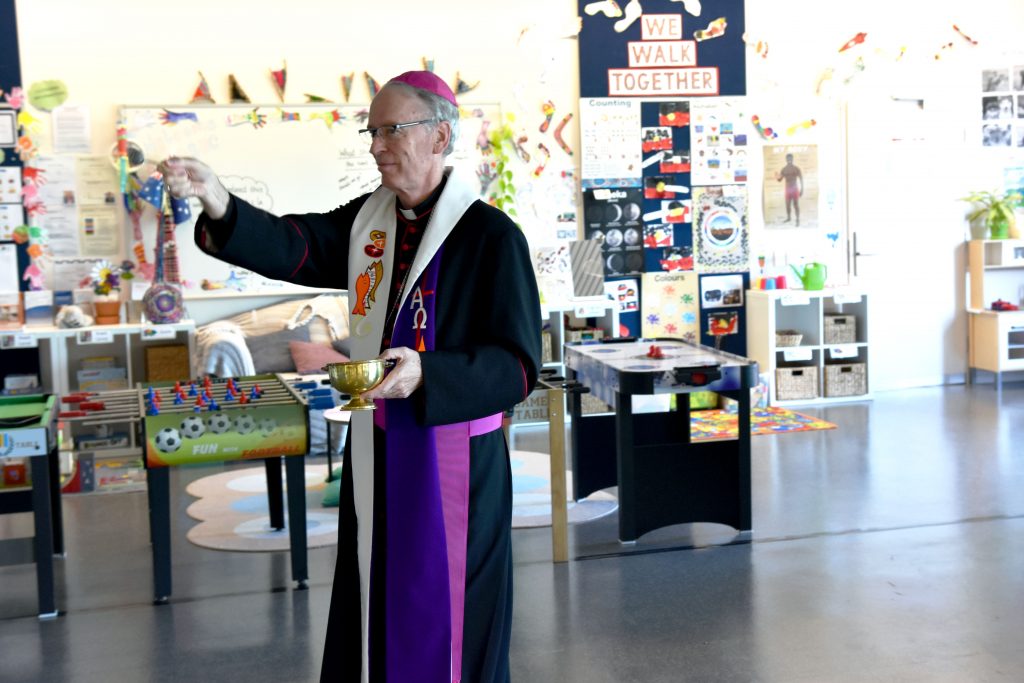 Bishop Donald Sproxton blesses one of the new classrooms. Photo: Daniele Foti-Cuzzola