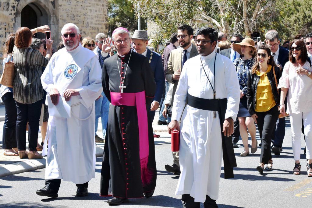 Archbishop Timothy Costelloe walks with Parish Priest of St Patrick’s Basilica, Fr John Sebastian OMI (right) and Deacon Patrick Moore during the 2016 Blessing of the Fleet. Fremantle Mayor, Brad Pettitt and Italian Consul for Perth, David Balloni, can be seen in the background. Photo: Daniele Foti-Cuzzola