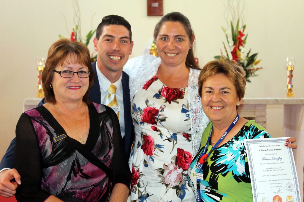 St Joseph’s School teacher, Rebecca Doughty, (second from right) celebrates with fellow staff members Caroline Parnham, Ryan Shelton and Jenny Stevenson after receiving the Sacraments of Baptism, Confirmation and Holy Communion. Photo: Supplied