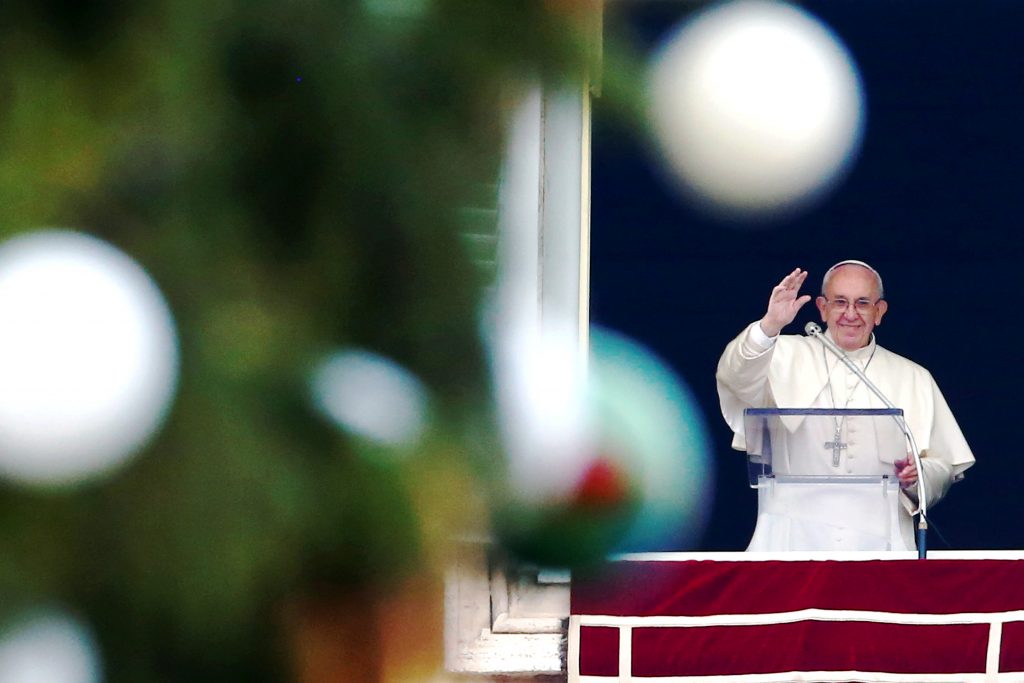 Pope Francis waves as he leads his Angelus on 4 December from the window of his studio overlooking St Peter's Square at the Vatican. Photo: CNS /Tony Gentile, Reuters