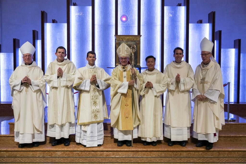 Perth Archbishop Timothy Costelloe (centre) with Auxiliary Bishop Don Sproxton (far right) and Ordinary of the Ordinariate of Our Lady of the Southern Cross, Mgr Harry Entwistle (far left) and the four newly ordained deacons, (from second left) Rev Konrad Gagatek, Rev Mariusz Grzech, Rev Tung Vu and Rev Joseph Laundy. Photo: Ron Tan