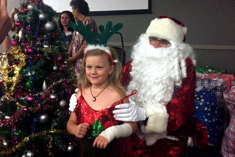 As per tradition, The Shopfront Christmas Party featured the arrival of Santa Claus, who handed out bags of gifts to all those present, giving guests - particularly children - the opportunity to sit on his lap, take photos and for those who wished to do so, exchange a few words. Photo: Supplied