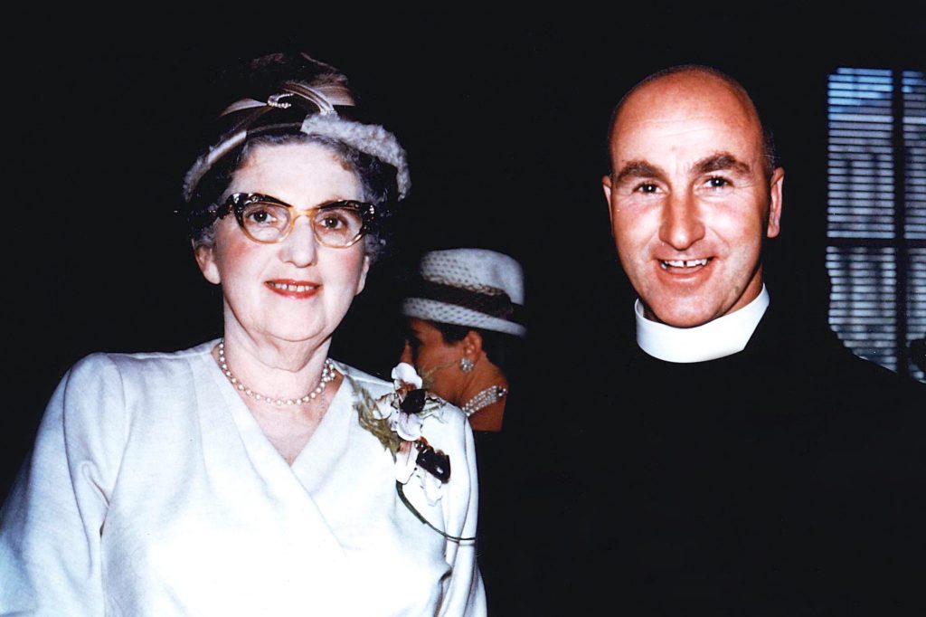 Pictured as a young priest in 1961 with one of his cousins, Father Michael Brown is remembered as a gentle and joyful man whose helpfulness knew no bounds. Photo: Supplied