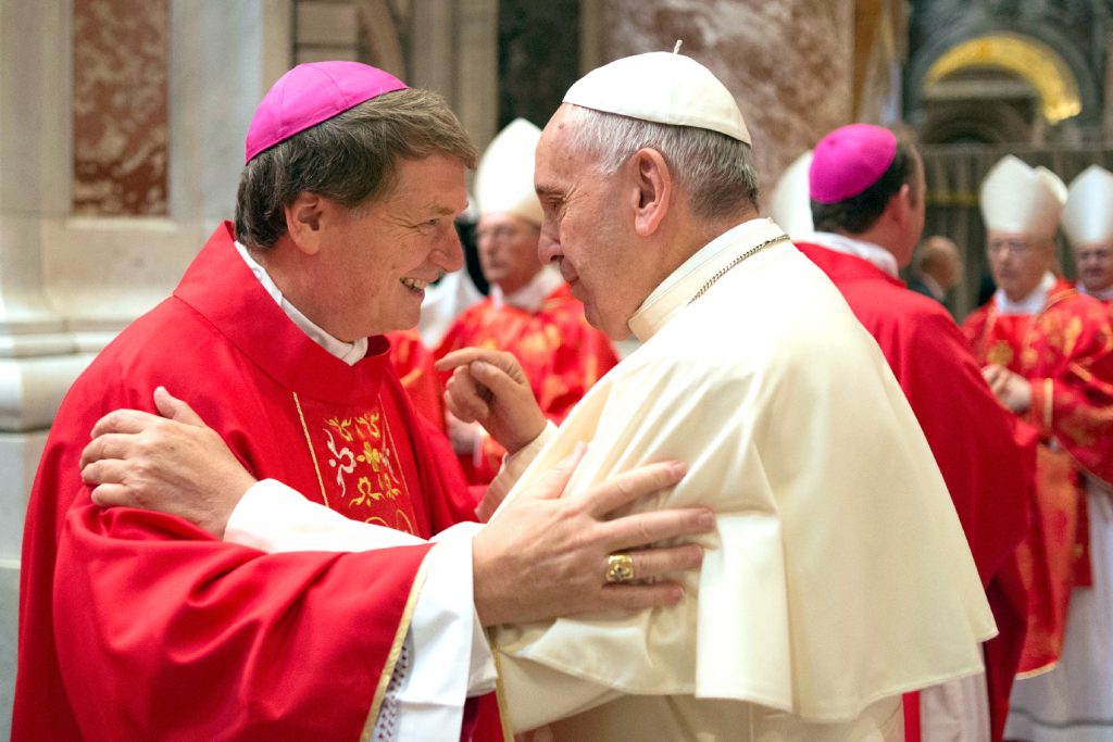 Pope Francis greets Archbishop Anthony Fisher of Sydney after a Mass in June 29. The Sydney Archbishop has this week told a New South Wales Parliamentary Inquiry about how he saved a South American nanny from slavery. Photo: CNS/Paul Haring