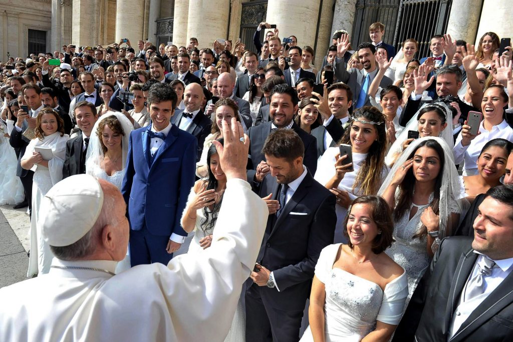 Pope Francis greets newly married couples during his general audience in St Peter's Square at the Vatican on 30 September 2015. Pope Francis' post-synodal Apostolic Exhortation on the family, Amoris Laetitia (The Joy of Love), was released on 8 April. The exhortation is the concluding document of the 2014 and 2015 synods of bishops on the family. Photo: CNS
