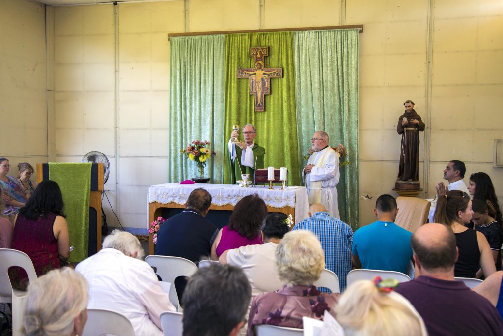 Bishop Don Sproxton proclaims the Eucharistic prayers during the closing Mass of St Francis of Assisi Church East Cannington. Photo: Jamie O’Brien