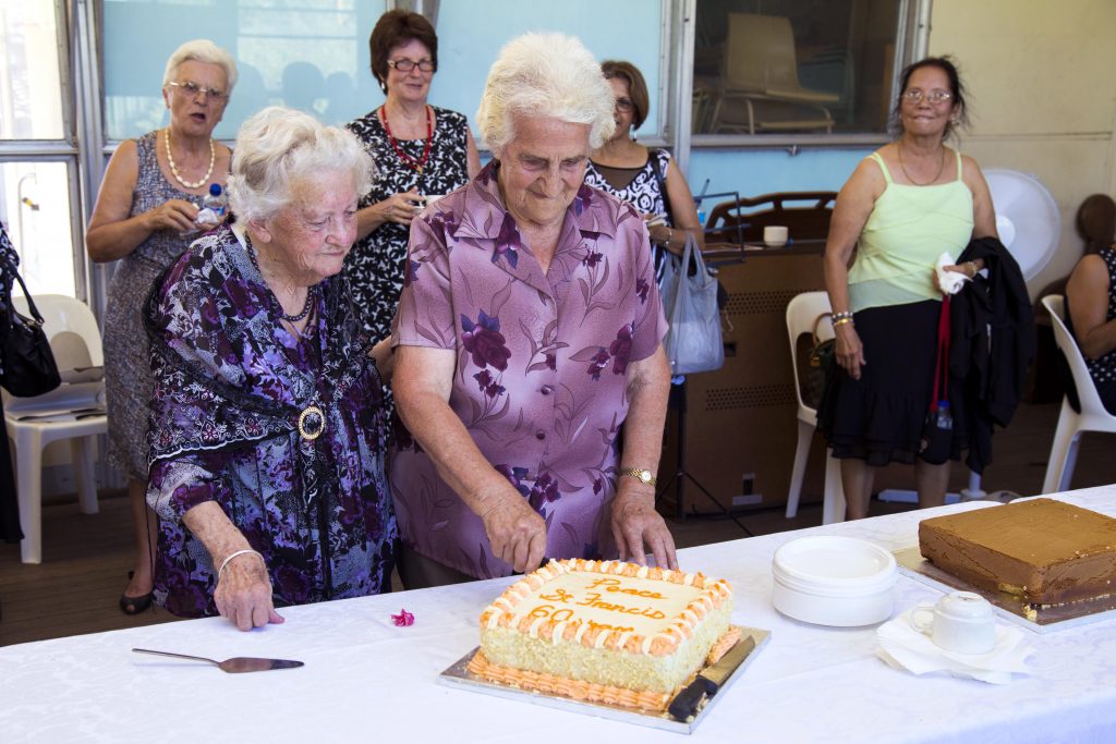 Parishioners celebrate with the cutting of a cake at the afternoon tea to celebrate the closing Mass of St Francis of Assisi Church East Cannington. Photo: Jamie O’Brien