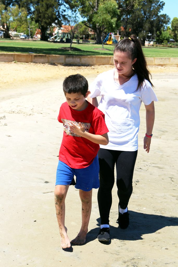 Providing a range of activities which are engaging and fun for nine year old Deklan is the focus for Identitywa support worker, Kimberley. Photo: Supplied