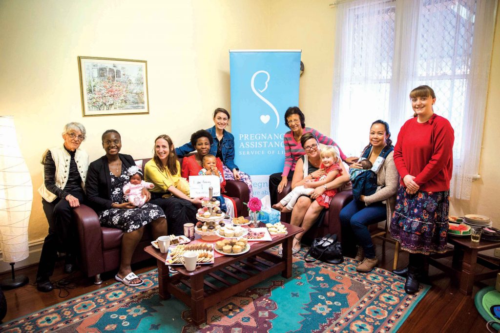 Coordinator Lara Wynyard (third from the left) with some of the volunteers and women who have been helped by Pregnancy Assistance at Pregnancy Assistance Mother’s Day breakfast, 6 May 2016. Photo: Monica Defendi