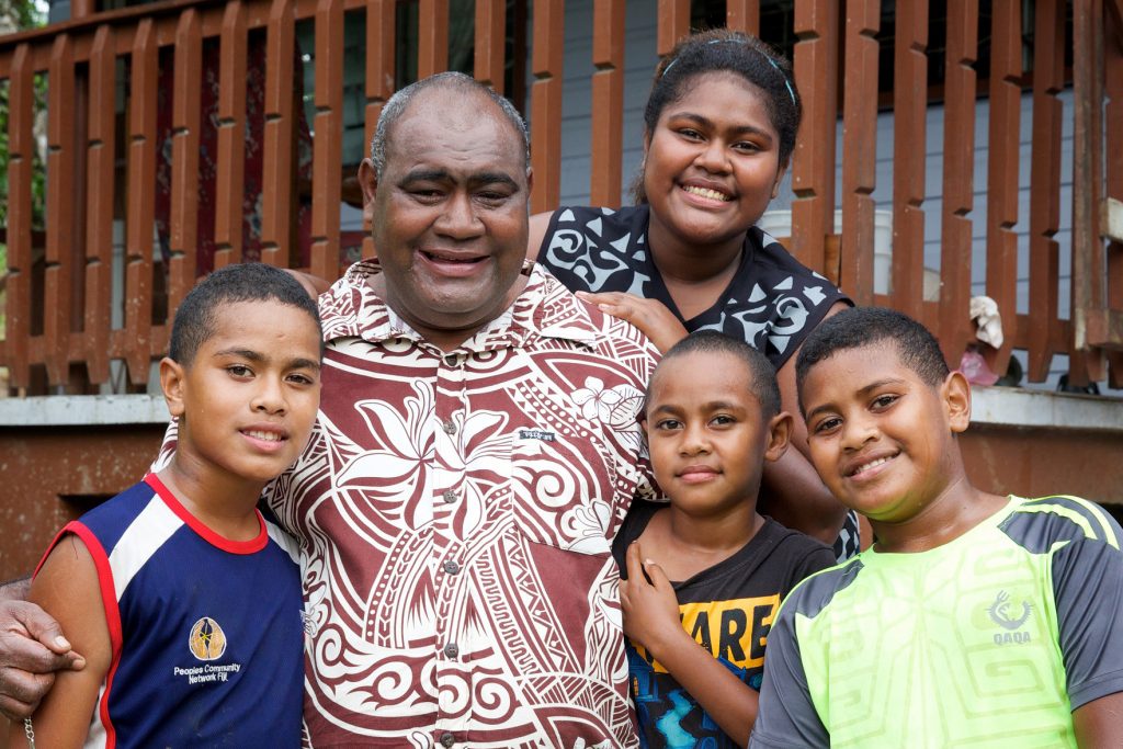 Semiti Qalowasa, the founder and national director of The Peoples Community Network (PCN) at home with some of his children. Richard Wainwright/Caritas Australia