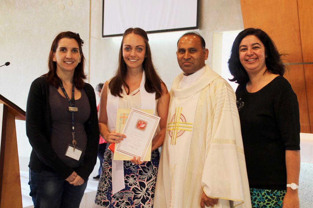 Left to right: Sponsor Katherine Gauci, Candidate Eleisha Hathaway, College Chaplain Fr Albert Saminedi and Director of Mission for Mercy College and Sponsor Melissa Cartner Photo: Supplied 
