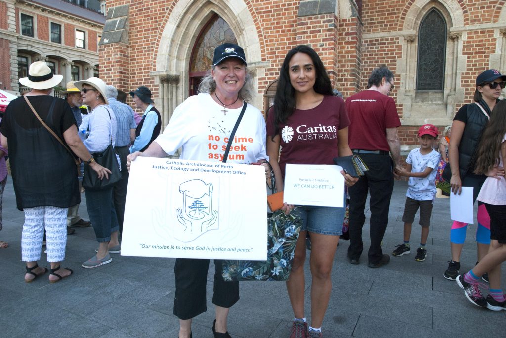Carol Mitchell, Director of the Archdiocese of Perth’s Justice, Ecology and Development Office (JEDO) with Caritas Australia WA/NT Justice Educator Anita Finneran at the annual Palm Sunday Walk for Refugees. Photo: Caroline Smith