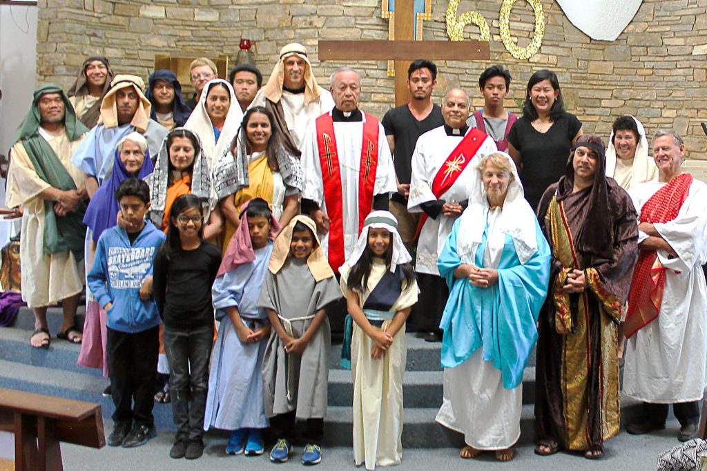 Fr Francis with all participants who enacted Good Friday’s Stations of the Cross. Photo: Supplied