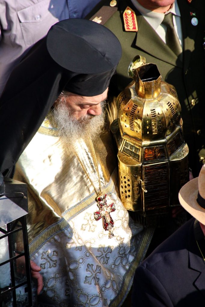 The Patriarch carrying the Holy Fire, that arrived by car from the Church of the Holy Sepulchre in Jerusalem to Beit Jala. Photo: Muzzie Rafferty