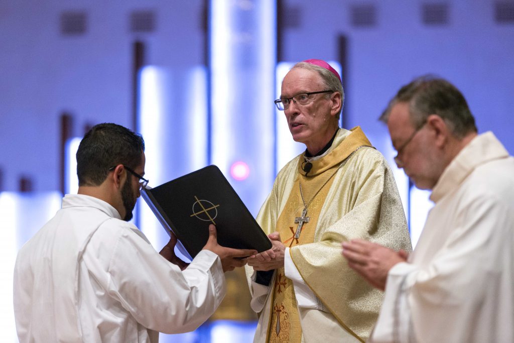 Most Rev Bishop Donald Sproxton called for the two newly ordained deacons to have courage and be the voice of Christ for people who have lost sight of God and His goodness. Photo: Ron Tan