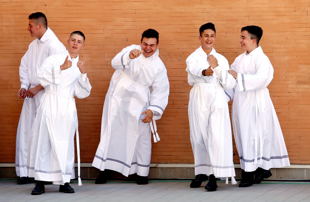Altar servers are seen before Pope Francis arrives for a visit to the parish of San Pier Damiani May 21 at Casal Bernocchi on the outskirts of Rome. Photo: CNS/Remo Casilli, Reuters. 