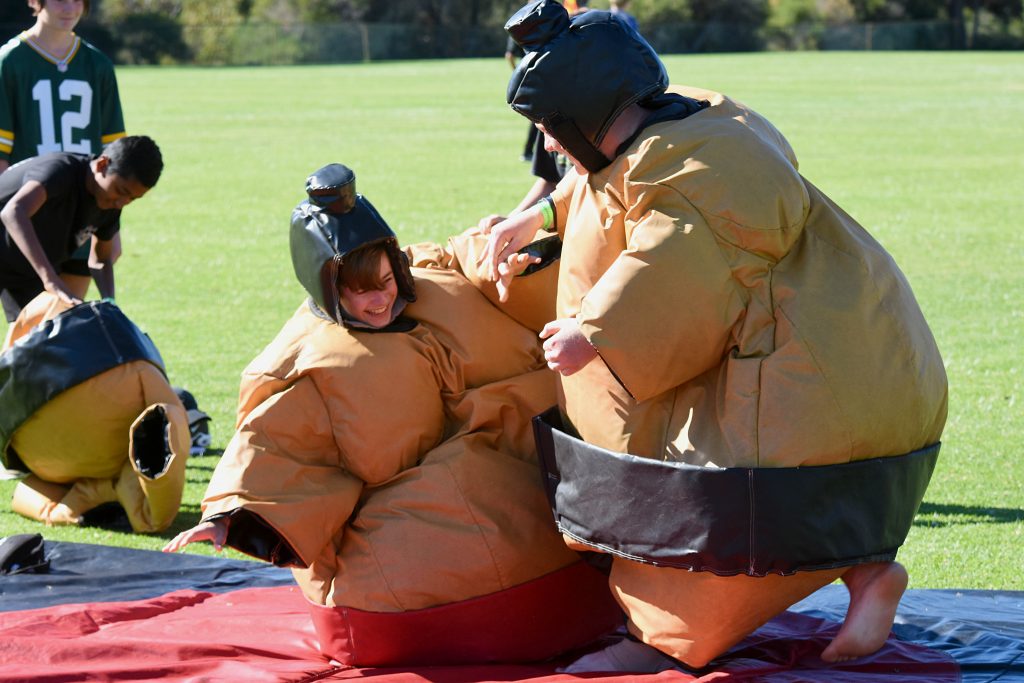 Students could take part in a range of activities which included a talent show, sumo suit wrestling, rock climbing, Zorb balls and a dunking machine to dunk their teachers. Photo: Josh Low