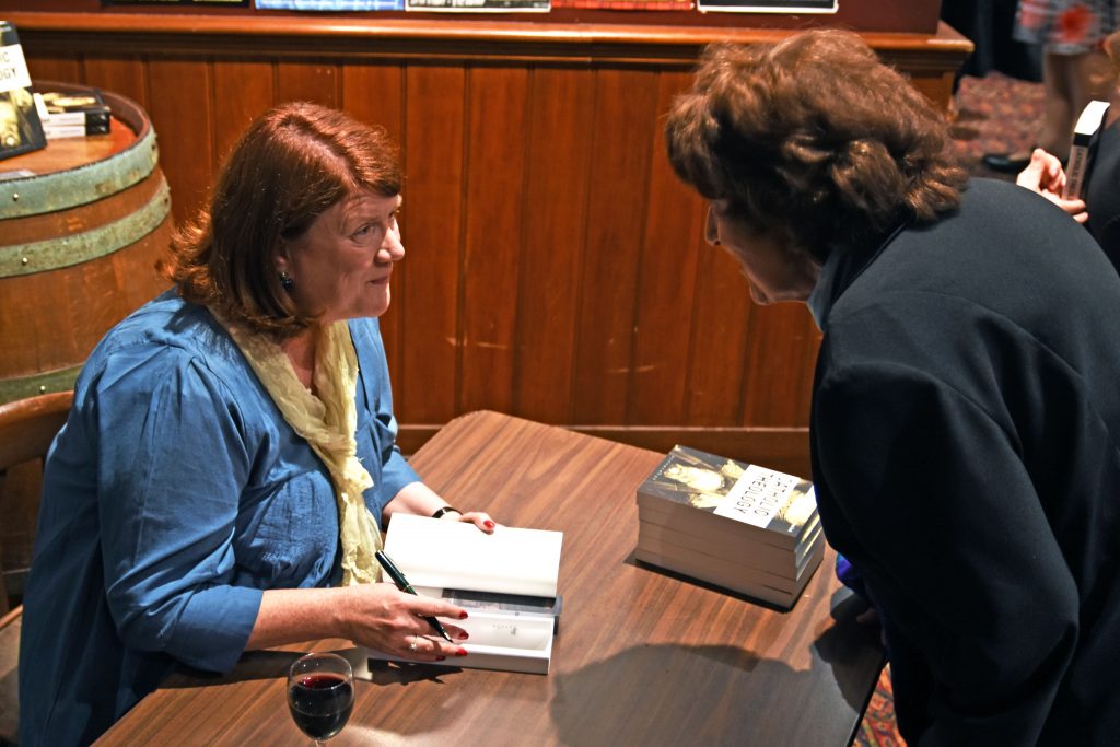 Prof Tracey Rowland signs books after her speech for the Dawson Society on Wednesday 26 April. Photo: Marco Ceccarelli