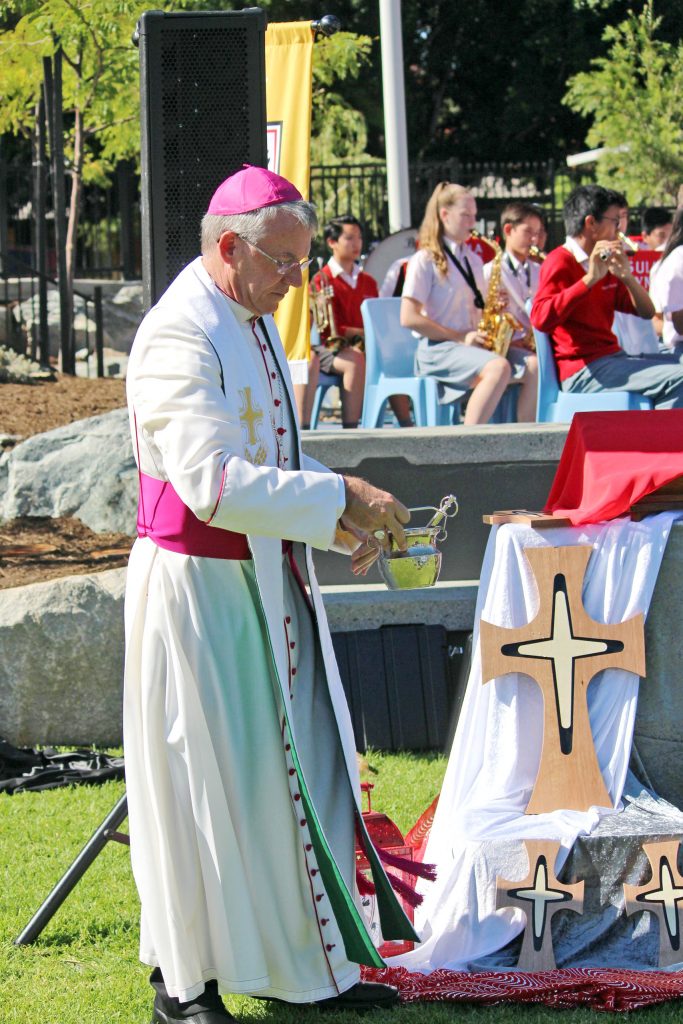 Archbishop Timothy Costelloe blessing the Mercy crosses that will be displayed in the new classrooms. Photo: Supplied