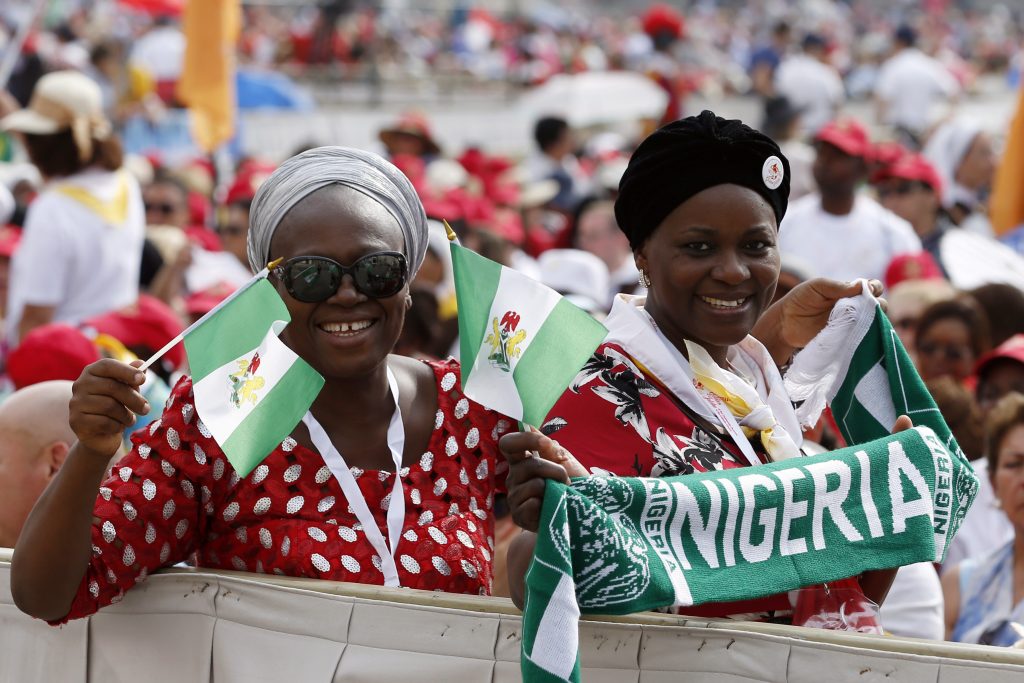 Pilgrims from Nigeria wait for the start of Pope Francis' celebration of Mass marking the feast of Pentecost in St Peter's Square at the Vatican on June 4. The Holy Father is giving priests belonging to the Diocese of Ahiara, Nigeria, 30 days to write a letter promising obedience to him and accepting the bishop appointed for their diocese or they will be suspended. Photo: CNS/Paul Haring. 
