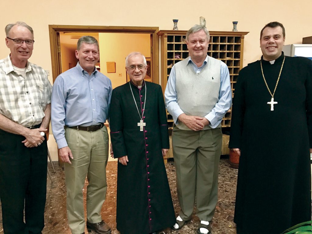 Perth Auxiliary Bishop Don Sproxton, far left, and former Auxiliary Bishop of Brisbane, Emeritus Bishop Brian Finnegan, fourth from left, with Tantur Ecumenical Institute Rector, Father Russ McDougall, and the local Syriac Catholic Bishop and Parish Priest. Photo: Gemma Thomson.