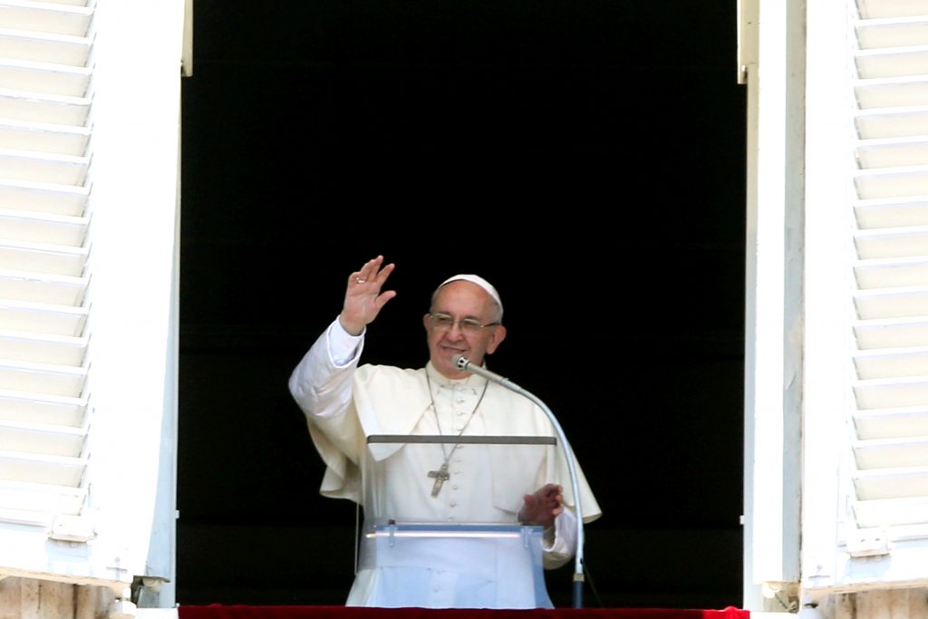 Pope Francis waves as he leads the Angelus from the window of his studio overlooking St Peter's Square on July 30 at the Vatican. Photo: CNS/Tony Gentile, Reuters.