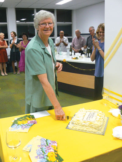 Sister Philomena celebrates her Golden Jubilee, which was attended by Archbishop Barry Hickey, by cutting the cake.