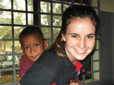 Mercedes College student Jocelyn MacRae and one of the children she met while volunteering in Cambodia. 