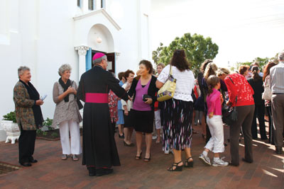 Archbishop welcomes parishioners at mass