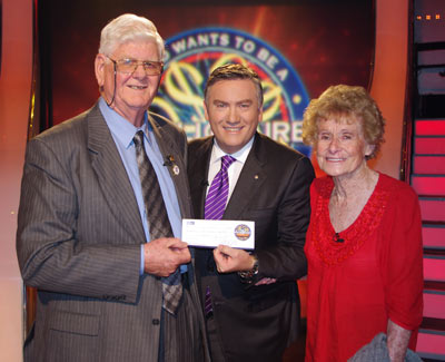 Hot Seat winner Wal Glynn (left) and his wife Nell (right) with host Eddie Maguire.