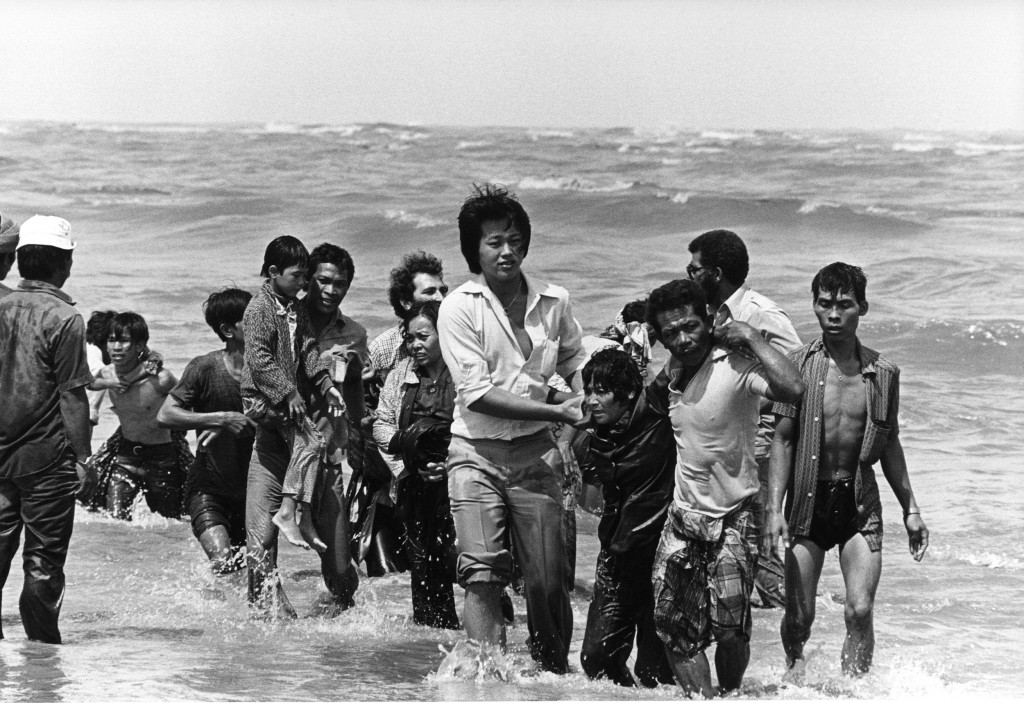A picture taken in the late 1970s shows a group refugees (162 persons) arrived on a small boat which sank a few meters from the shore in Malaysia.