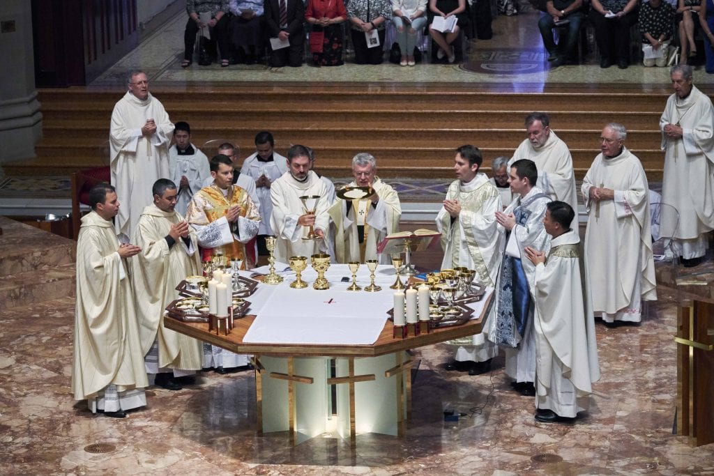 Archbishop Timothy Costelloe during the consecration of the body and blood of Christ with the newly ordained on Friday 17 November at St Mary’s Cathedral. Photo: Ron Tan.