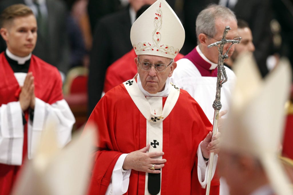 Pope Francis leaves after celebrating Mass marking the feast of Pentecost in St Peter's Basilica at the Vatican on 20 May. The Pope at his "Regina Coeli" announced that he will create 14 new cardinals on 29 June. Photo: Paul Haring/CNS.