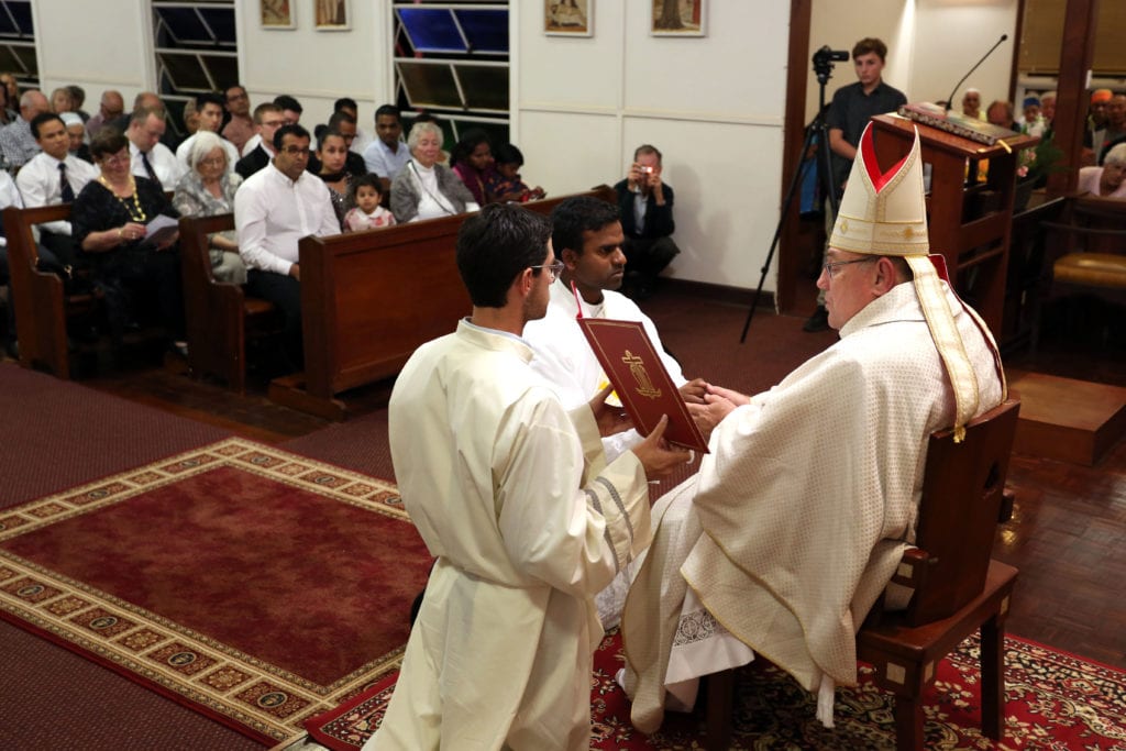 John Bosco make his vows before Broome Bishop Christopher Saunders on Saturday 23 June during his Ordination to the Priesthood at Our Lady Queen of Peace Cathedral. Photo: Supplied.