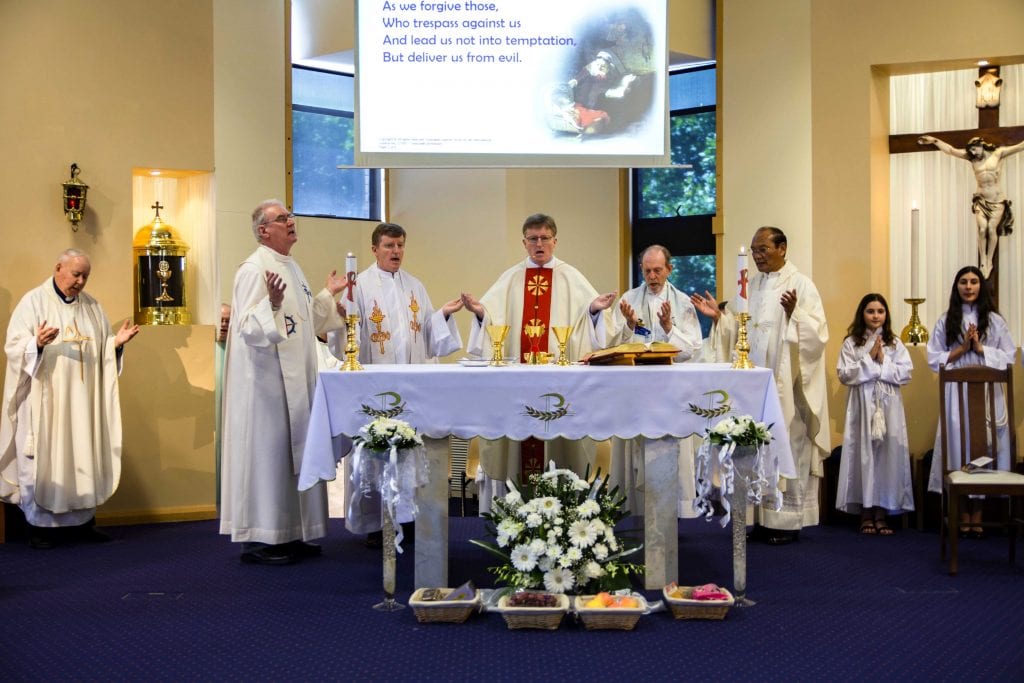 From left: Fr Paul Carey, Fr Kelvin Barrett, Fr Peter O’Neill, former Superior General Fr Kevin O’Neill, Fr Peter Toohey, and Como Parish Priest Fr Ossie Lewis celebrate the centenary Mass on 3 November. Photo: Matthew Lau.