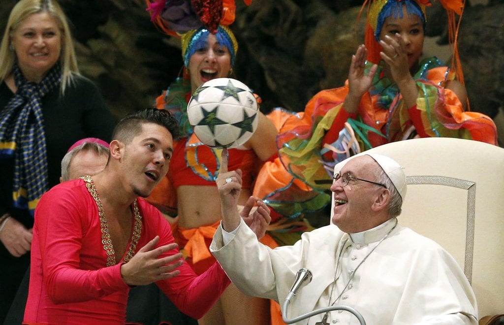 Pope Francis twirls a football presented by a member of CirCuba, the Cuban national circus, during his general audience in Paul VI hall at the Vatican on 2 January. Photo: Paul Haring/CNS.