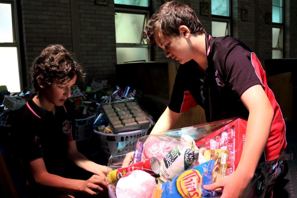Seton Catholic College students assist with preparation of the hampers. Photo: Supplied