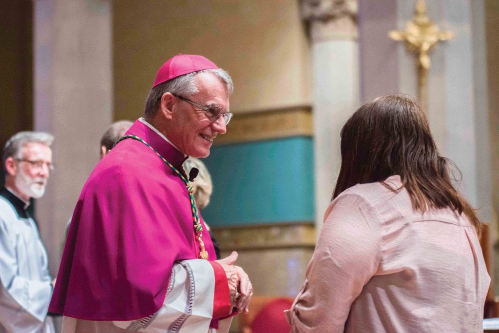 Archbishop Timothy Costelloe SDB listens to the experience of a young woman entering the Church in 2018. Photo: Ron Tan.