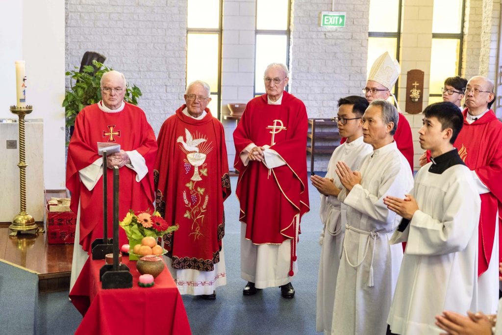 The concelebrating priests, bishop, and altar servers observe the Chinese ancestral ritual after the conclusion of Mass on Sunday 10 February. Photo: Matthew Lau.