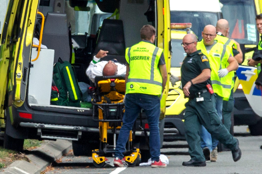 An injured man is loaded into an ambulance following a shooting at the Al Noor Mosque in Christchurch, New Zealand on 15 March 2019. New Zealand's Catholic bishops expressed their horror and distress at terrorist attacks on two mosques in Christchurch; at least 50 were people killed. Photo: CNS/Martin Hunter, Reuters.