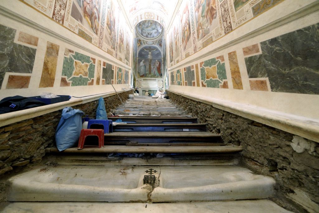 The Holy Stairs with concave indentations from years of wear from pilgrims are seen at the Pontifical Sanctuary of the Holy Stairs in Rome March 15, 2019. Vatican restorers have removed the wood covering the stairs, which tradition maintains Jesus climbed when Pilate brought him before the crowd. Pilgrims will have the opportunity to climb the bare marble stairs for at least a month after an April 11 unveiling of the renovated sanctuary. Photo: CNS/Paul Haring.