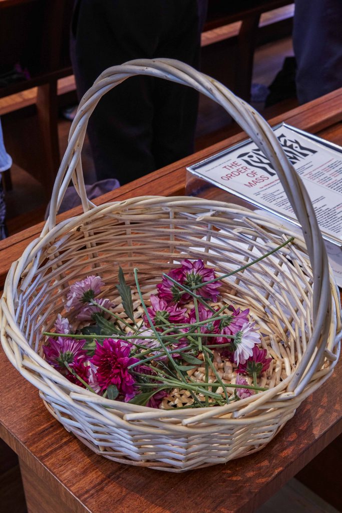 Those who attended the Day of the Unborn Child Mass at St Mary’s Cathedral on Saturday 23 March were invited to put a flower in a basket, in honour of the children who have died at birth through miscarriage, stillbirth, abortion or other causes. Photo: Ron Tan.