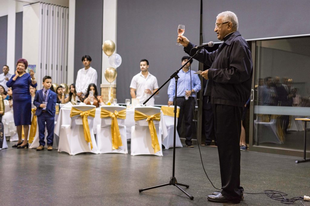 Mrs Carvalho’s godson Fr Gino Henriques CSsR raises his glass to toast the 100-year-old lady. Photo: Eric Martin.